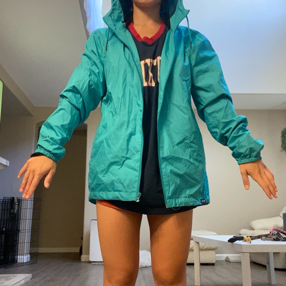 Small Oakley teal wind breaker